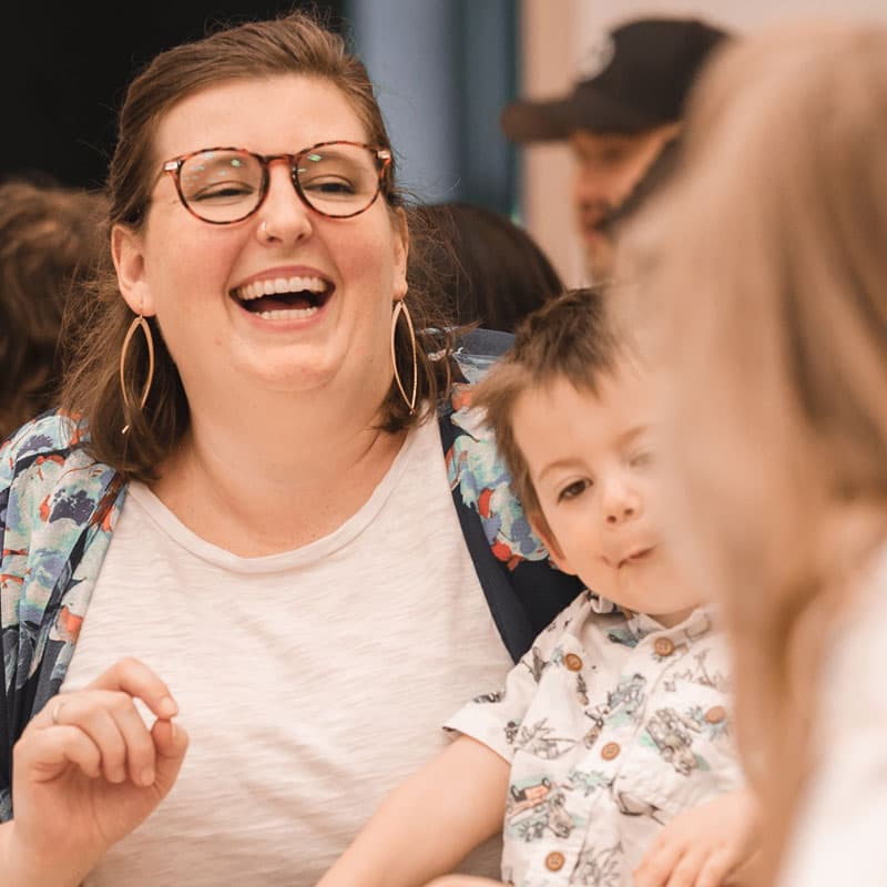 A woman laughing during a Founded in Truth women’s gathering