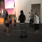 Youth group at church dancing during worship