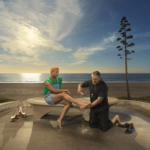 A priest washes the feet of a gay man